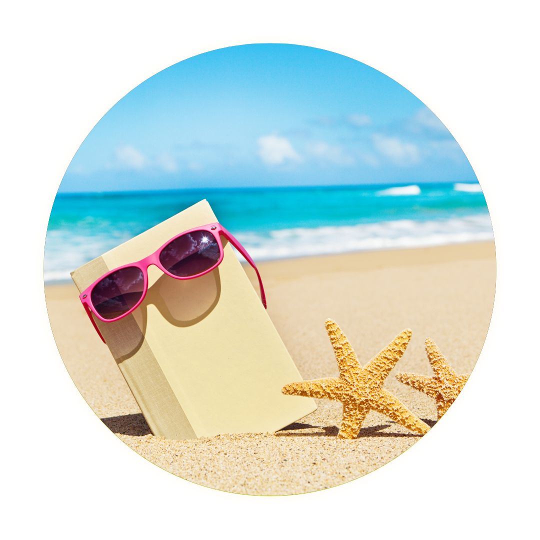 Summer Reading book with sunglasses on beach with starfish
